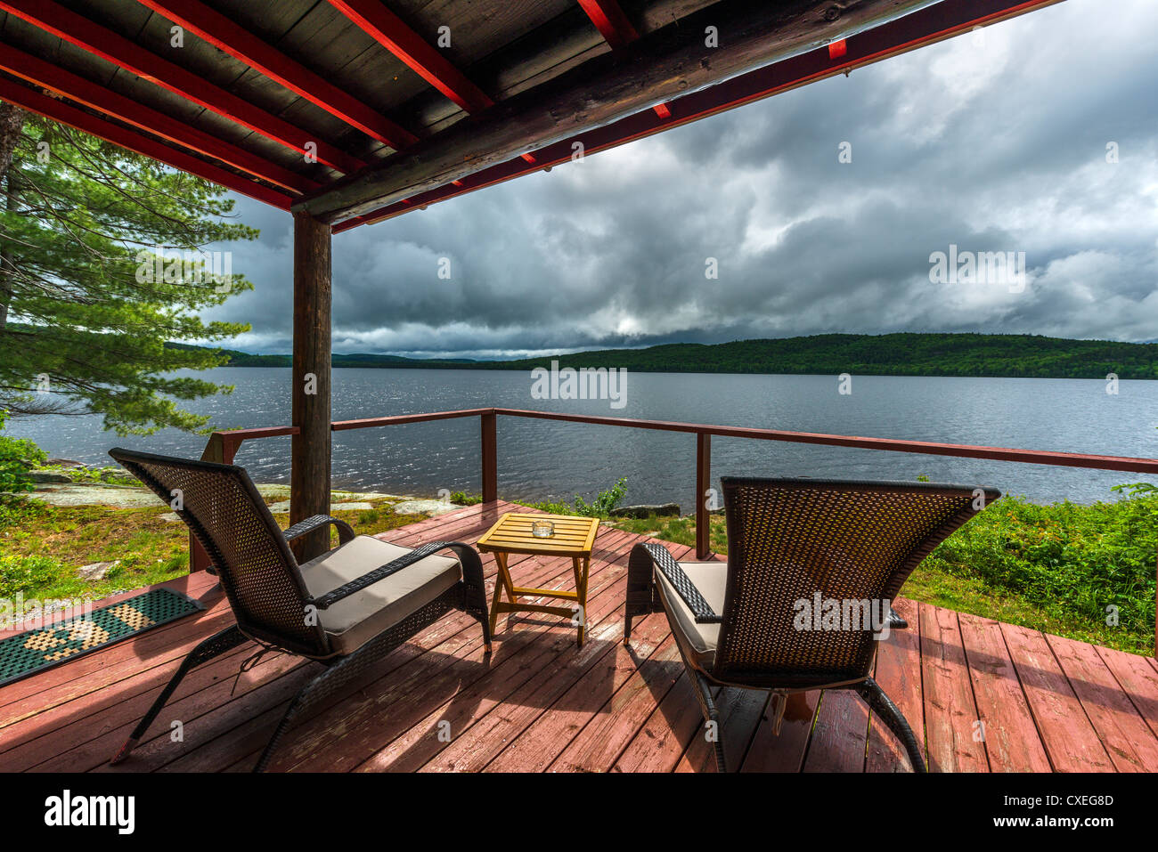 Deck of lakefront cabin at the Killarney Lodge resort just before a storm, Lake of Two Rivers