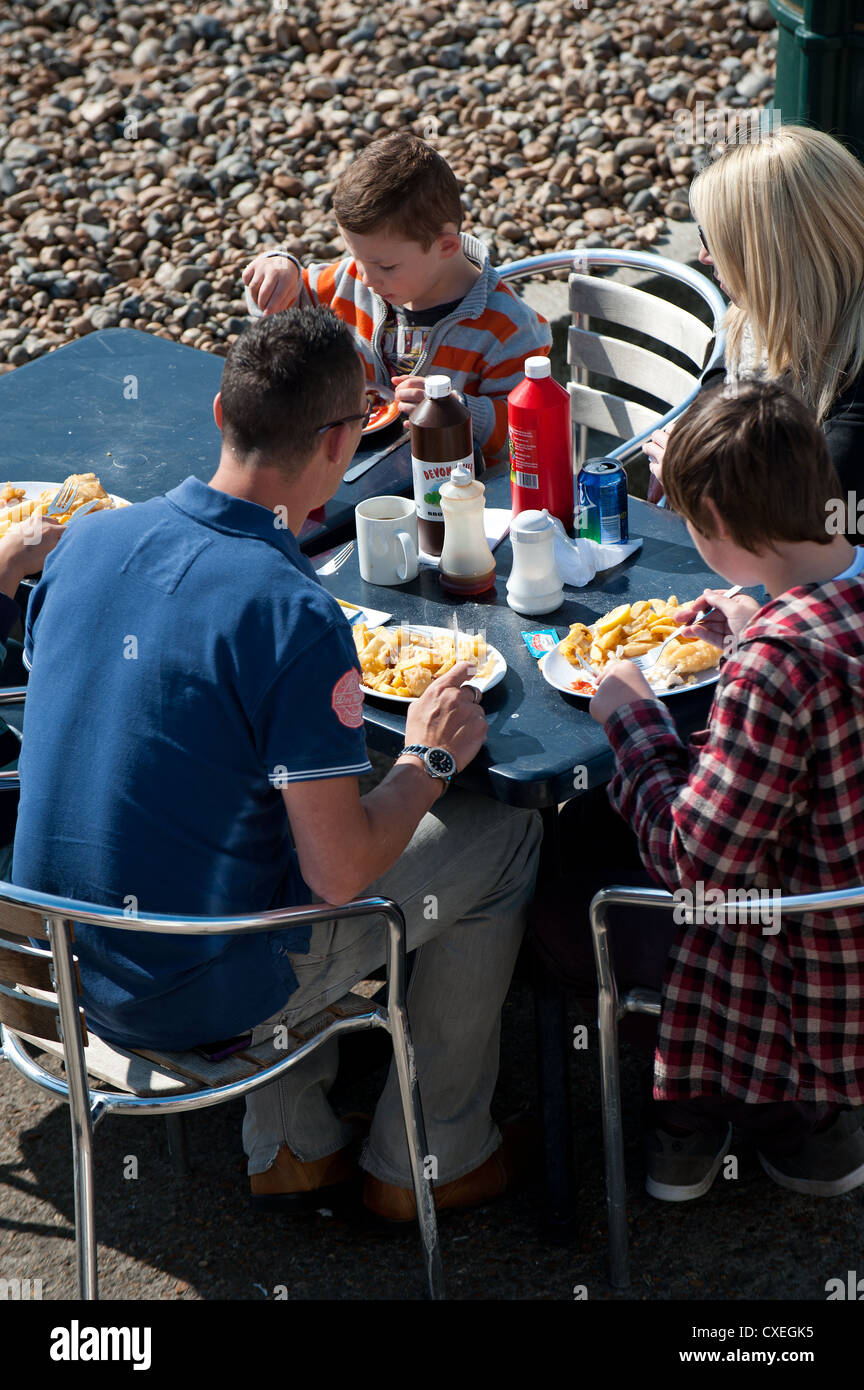 A family eating fish and chips on Brighton seafront Stock Photo Alamy