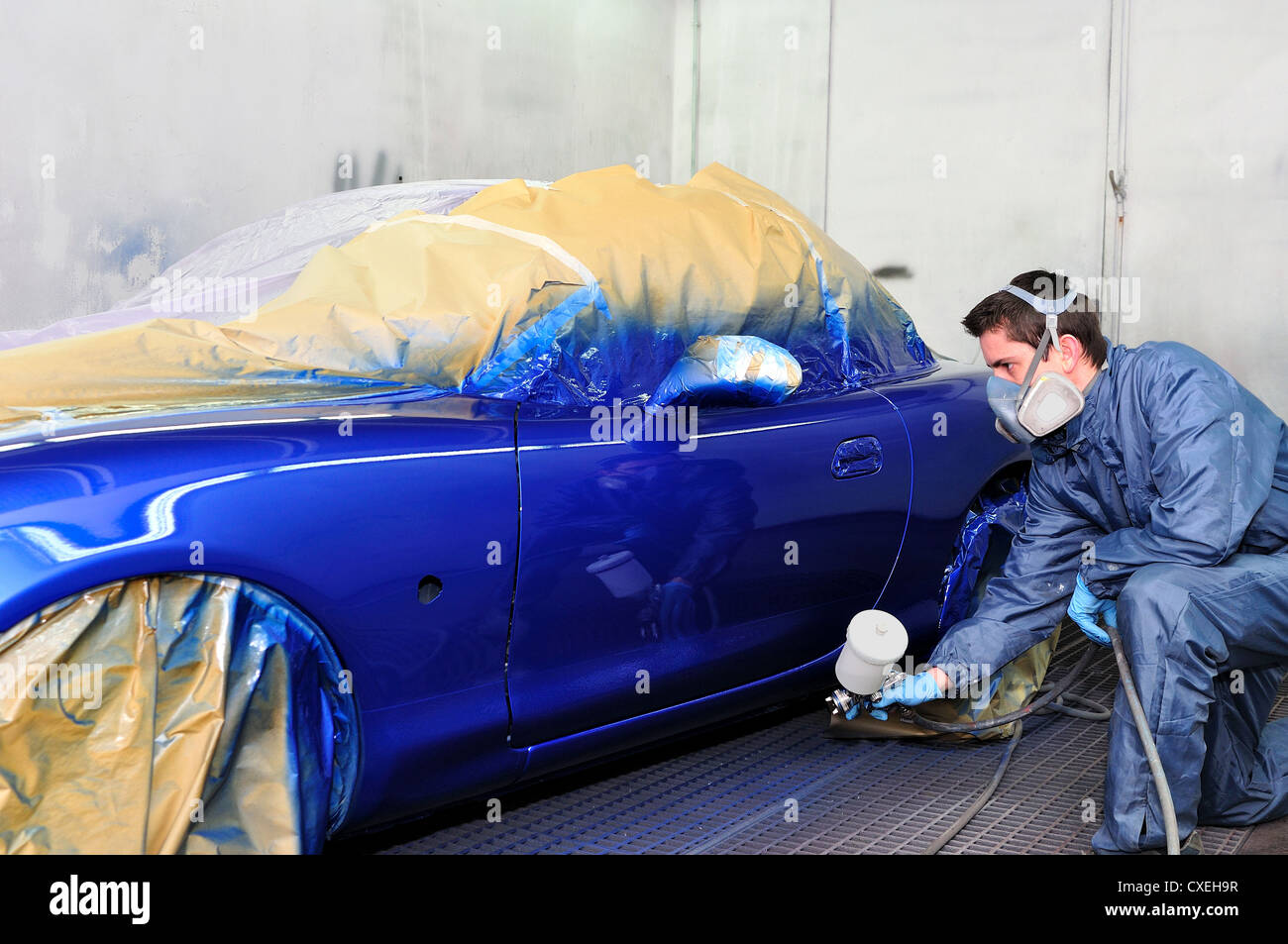 Worker painting a car Stock Photo Alamy