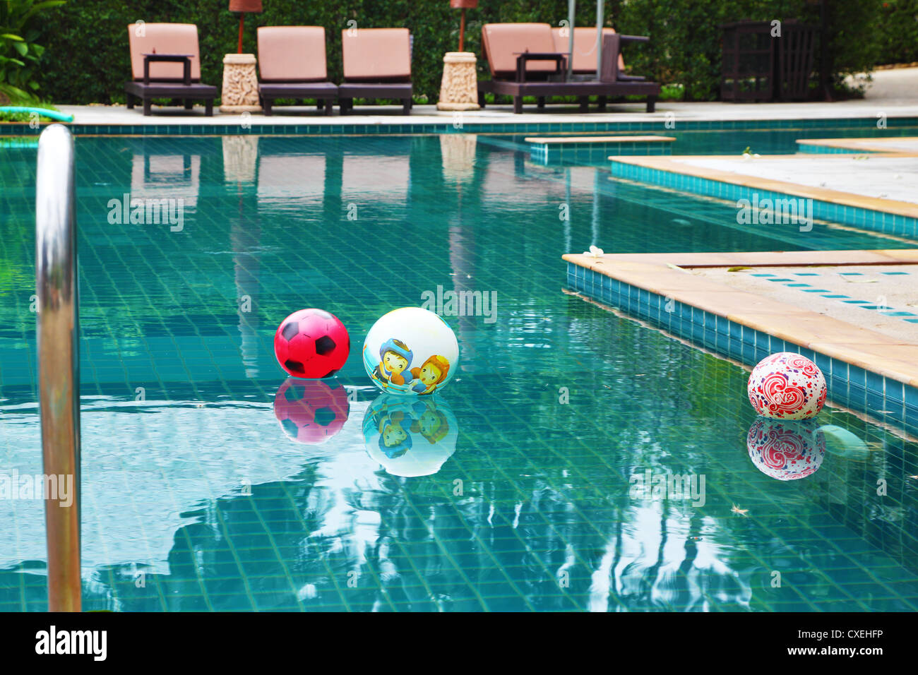Three beautiful colored balls in the pool Stock Photo