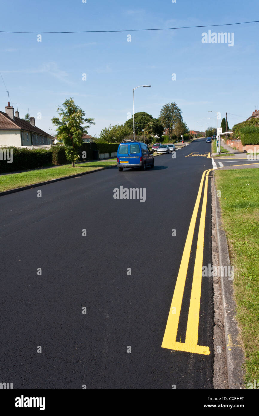 Newly painted lines on a freshly tarmacked road Stock Photo Alamy