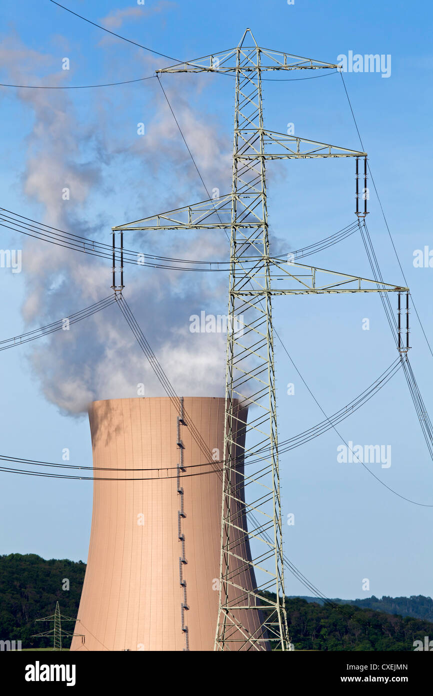 Smoking cooling tower with power poles Stock Photo