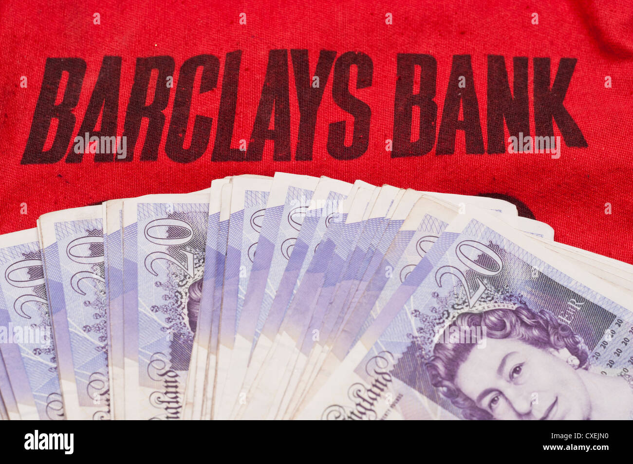 Cash on a Barclays Bank Money bag. Stock Photo