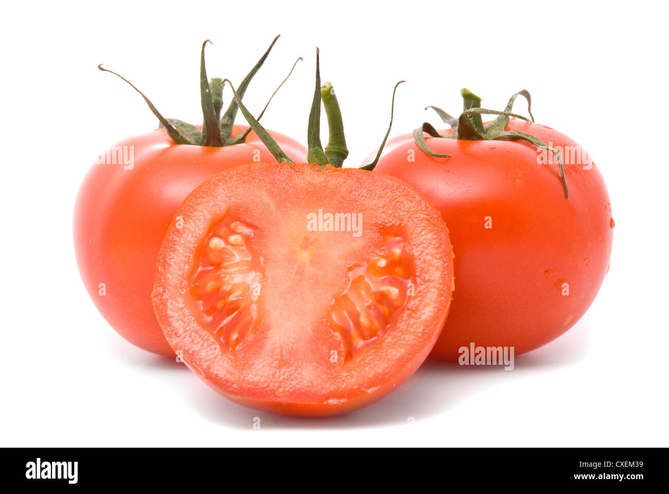 Fresh tomatoes isolated on white. Stock Photo