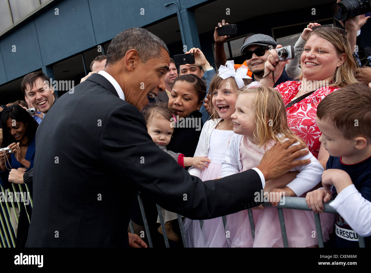 US President Barack Obama greets children upon arrival September 25, 2011 in Seattle, Washington. Stock Photo