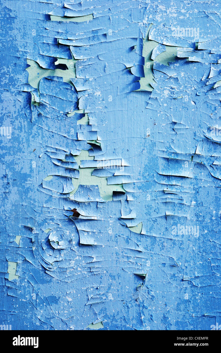 closeup of blue wooden wall with cracked paint Stock Photo