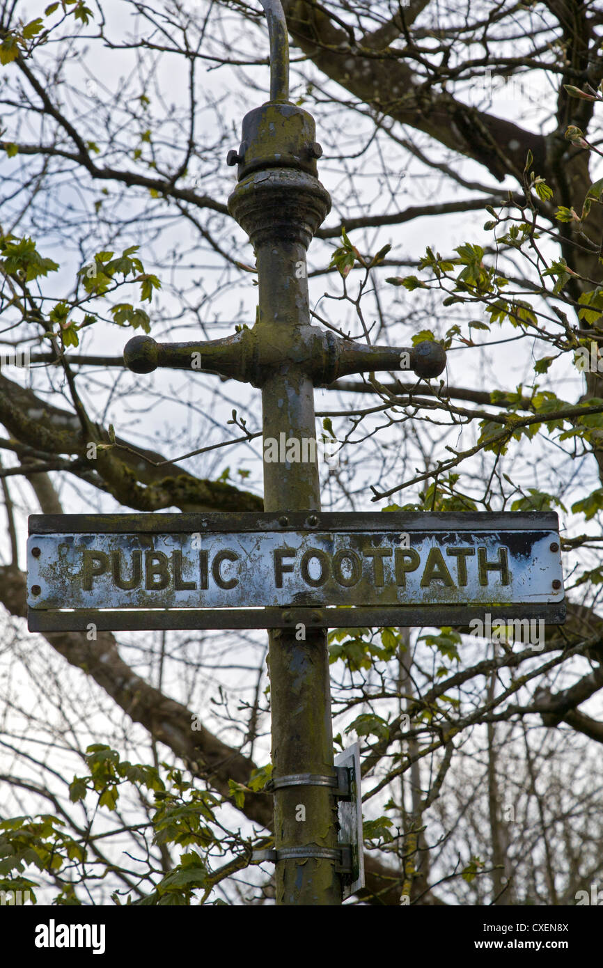 Late 19thC lamp post with public footpath notification added. Stock Photo