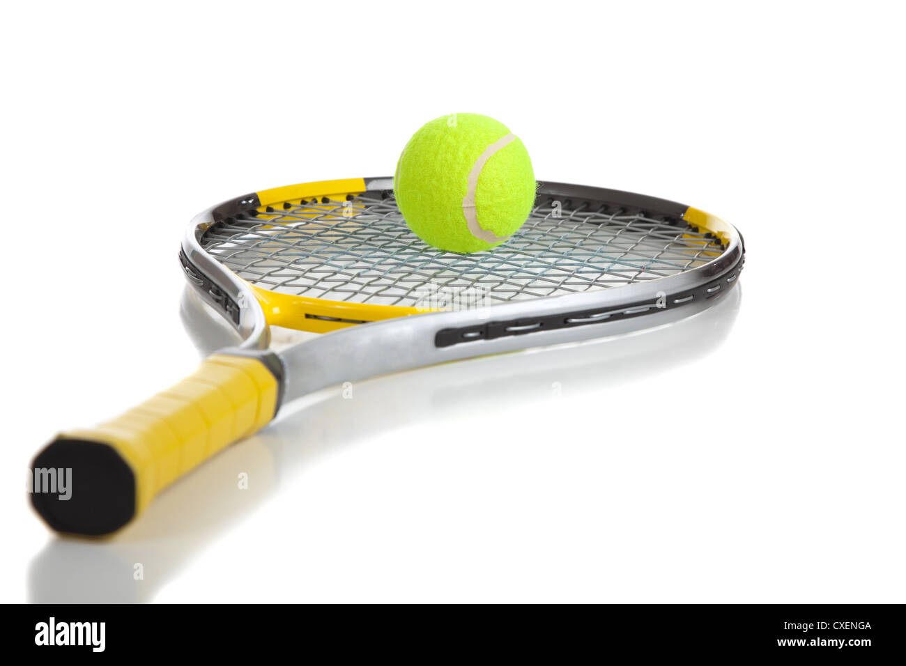 A metal tennis racket and yellow tennis ball on  a white background Stock Photo