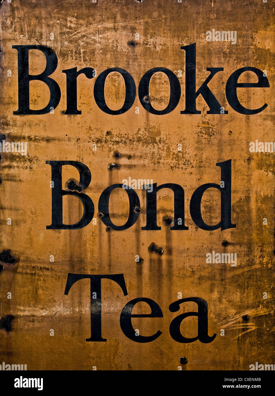 Enamel metal Brooke Bond Tea sign dating from the 1940's. Rusting and oxidised. Stock Photo