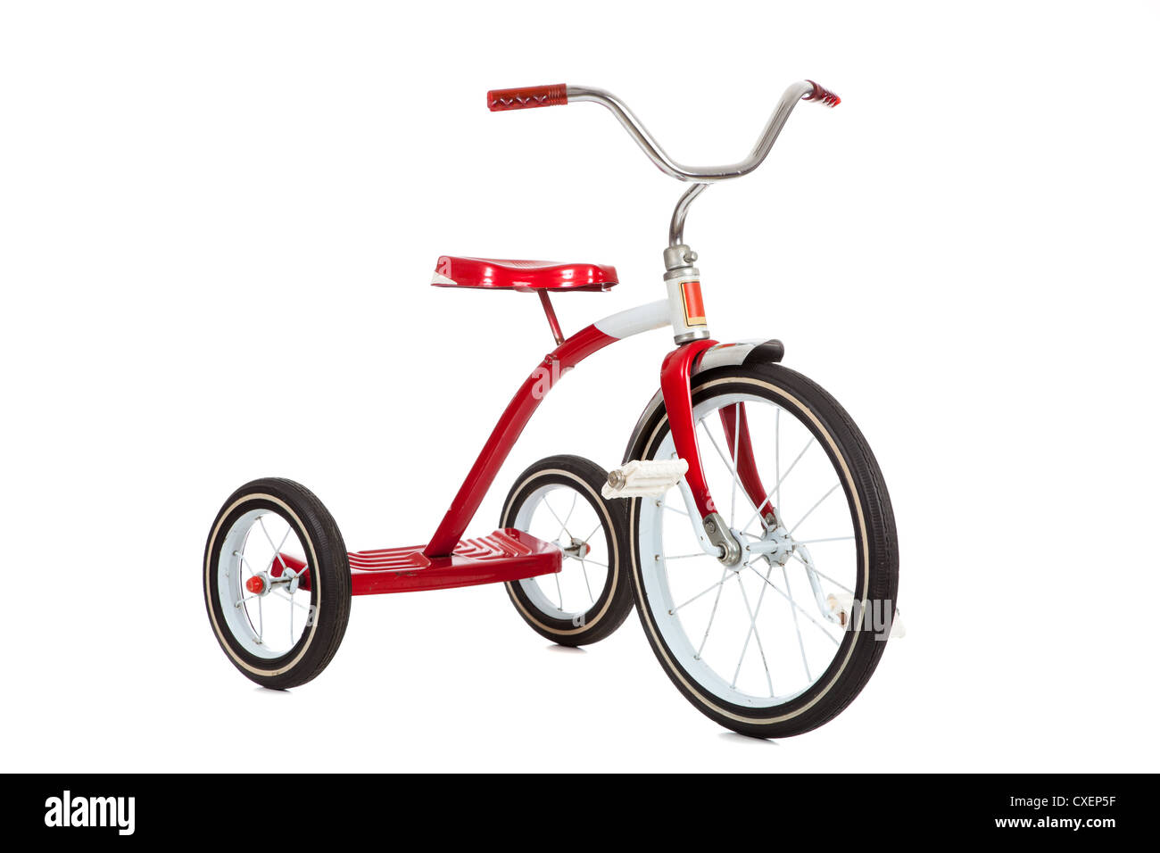 Red vintage tricycle on a white background Stock Photo - Alamy