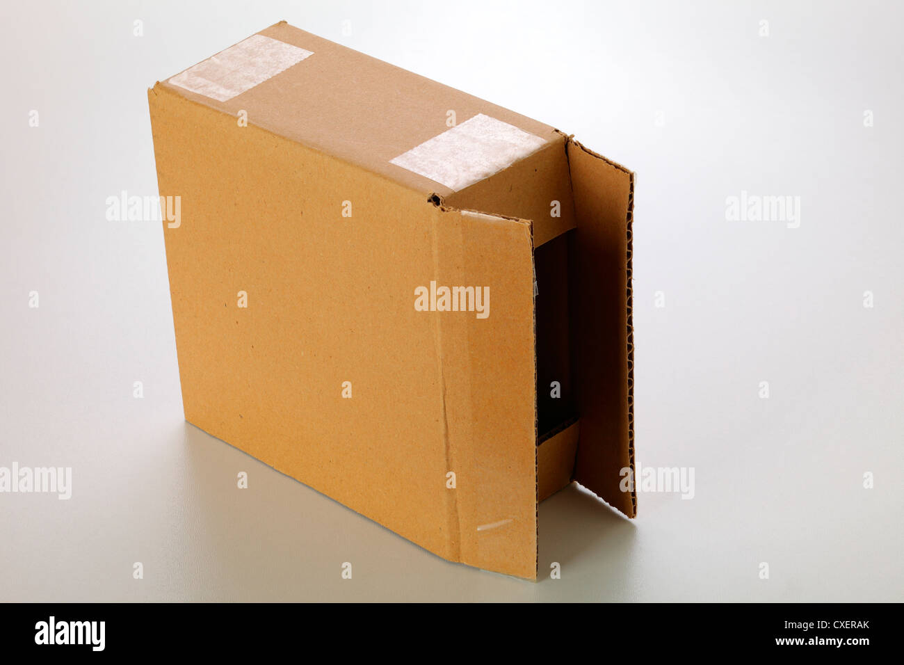 A cardboard box isolated on grey background Stock Photo - Alamy