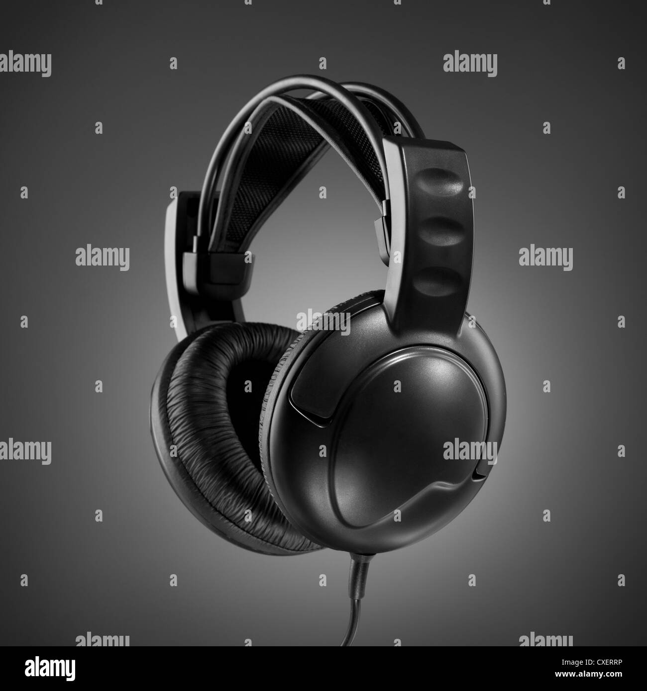 Headphones on grey background Stock Photo - Alamy