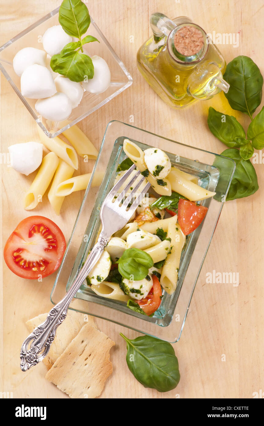 Pasta with Caprese salad Stock Photo