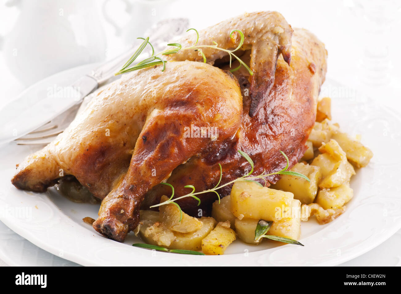 chicken roasted with potato and herbs Stock Photo