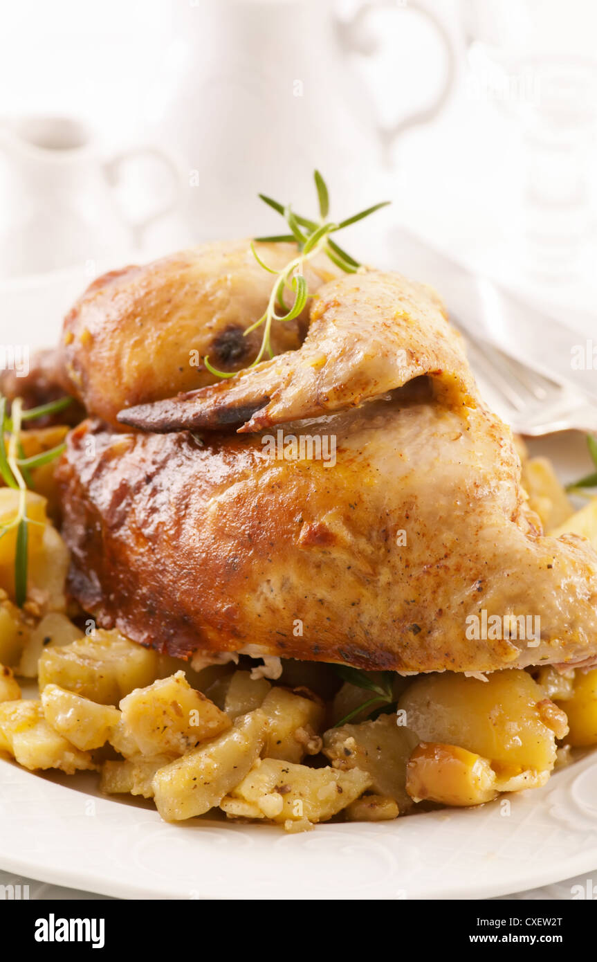 Roasted chicken with potato Stock Photo Alamy