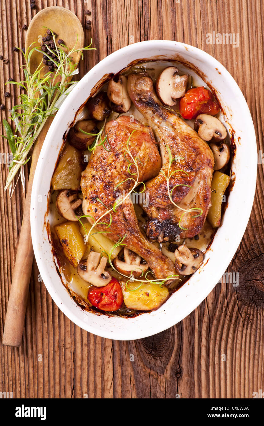 chicken roasted with the mushrooms and potato Stock Photo Alamy