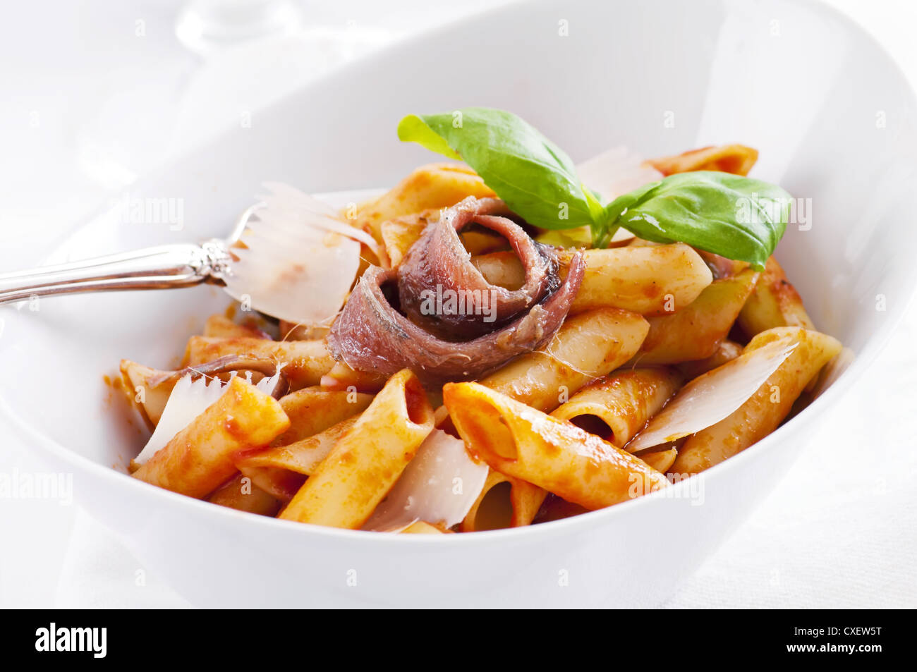 Penne Lisce with anchovy and parmesan Stock Photo