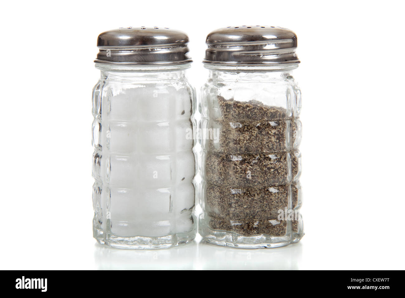 Clear glass salt and pepper shakers Stock Photo