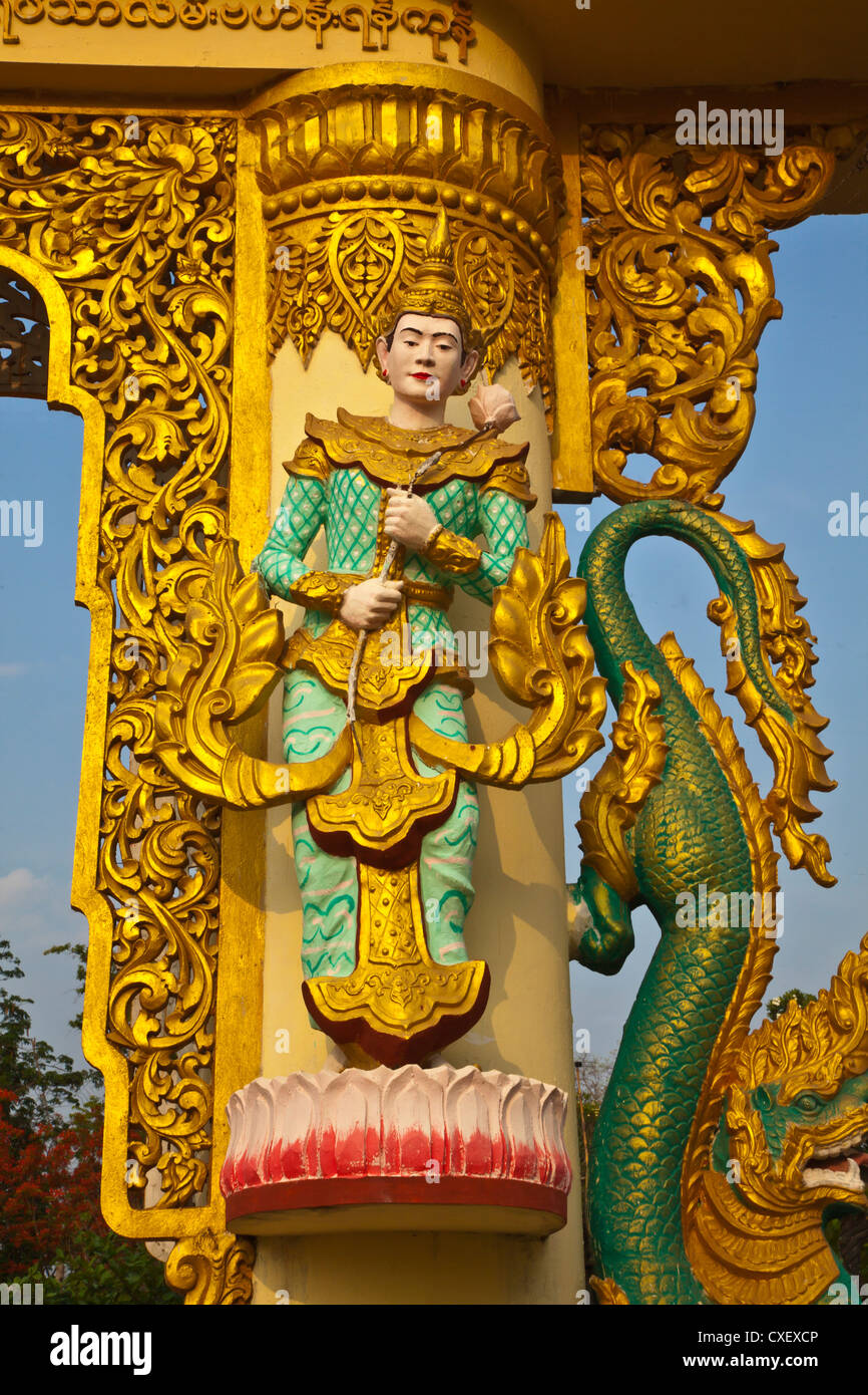 CELESTIAL BEING carved on a gate pillar - BAGO, MYANMAR Stock Photo