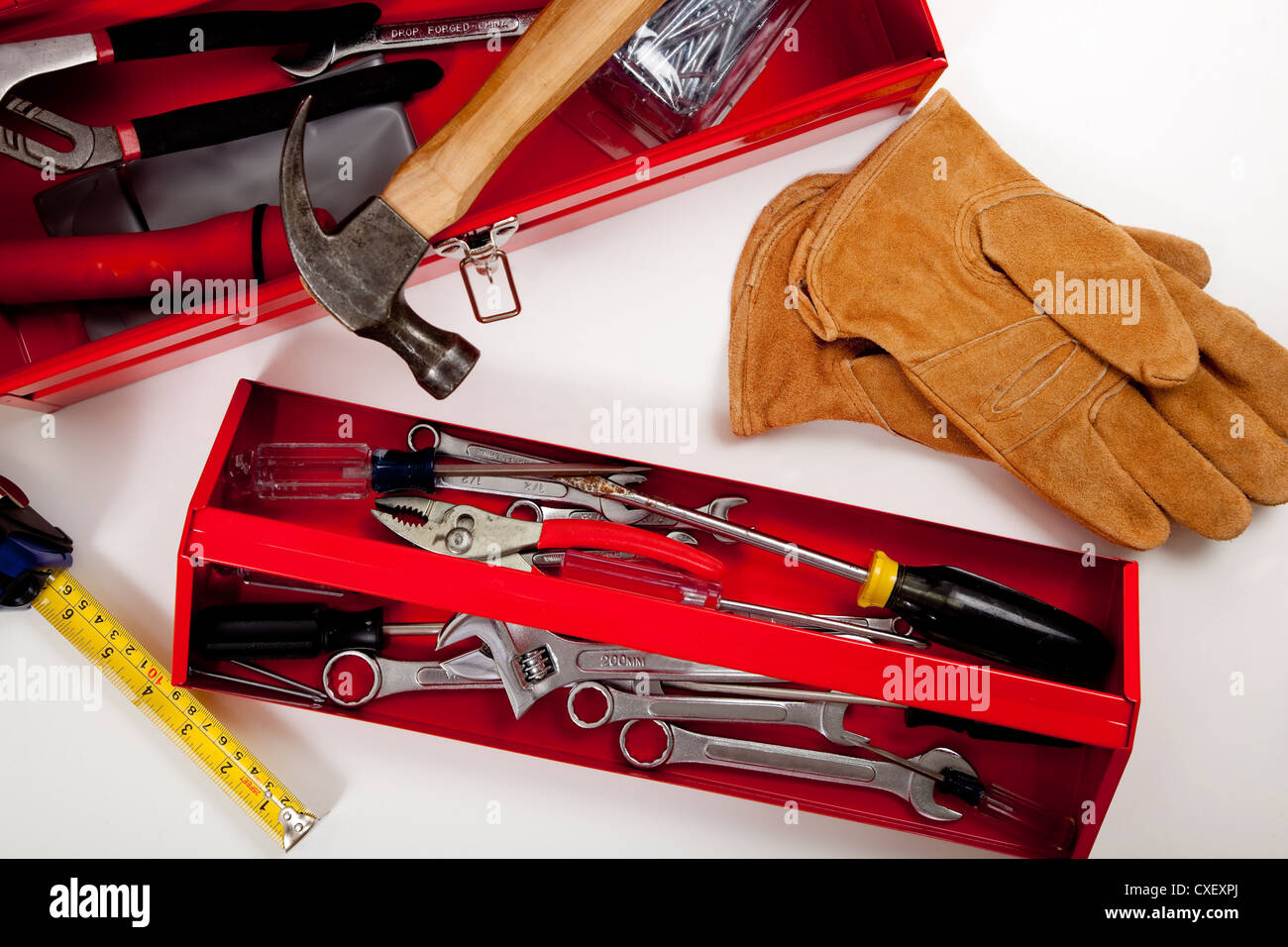 Red toolbox with various tools on a white background Stock Photo - Alamy