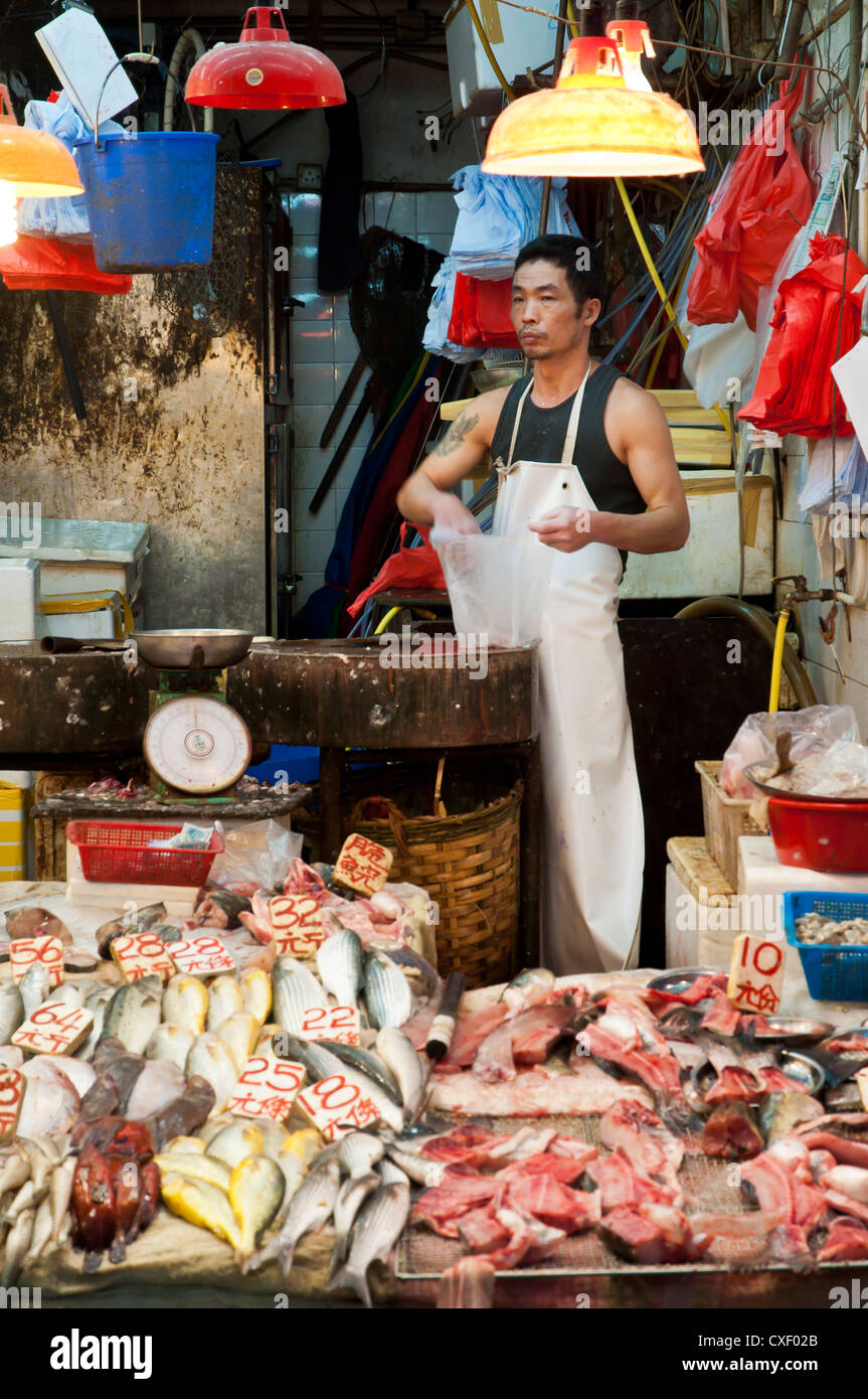 Fishmonger at Wan Chai wet market, Hong Kong Stock Photo