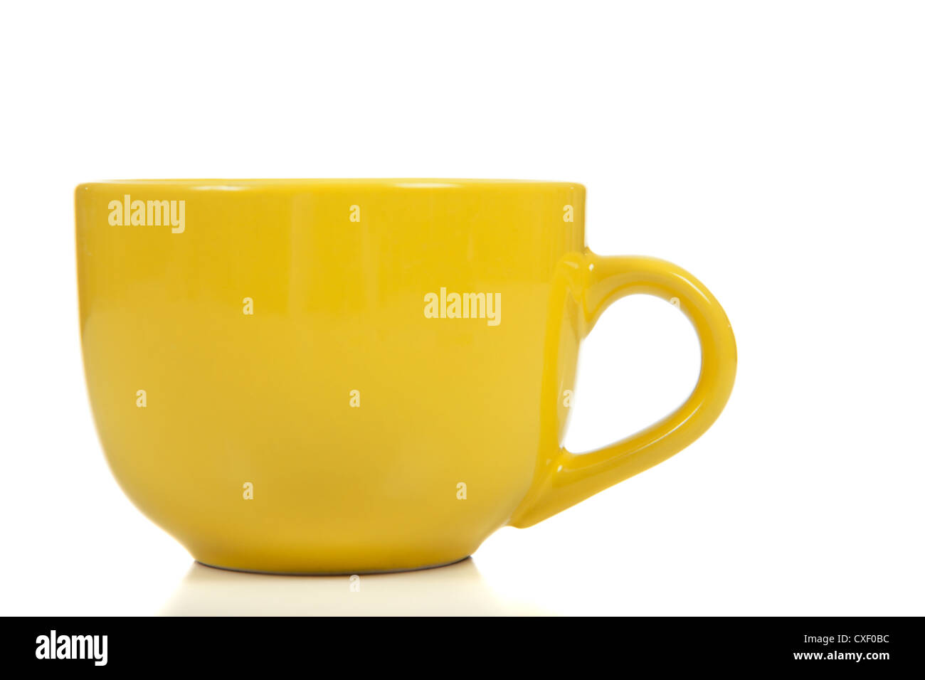 Yellow mug on a white background Stock Photo