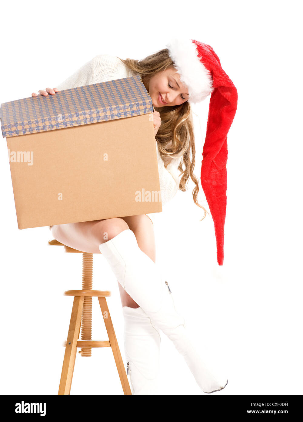 Attractive girl in Santa  hat with fancy box Stock Photo