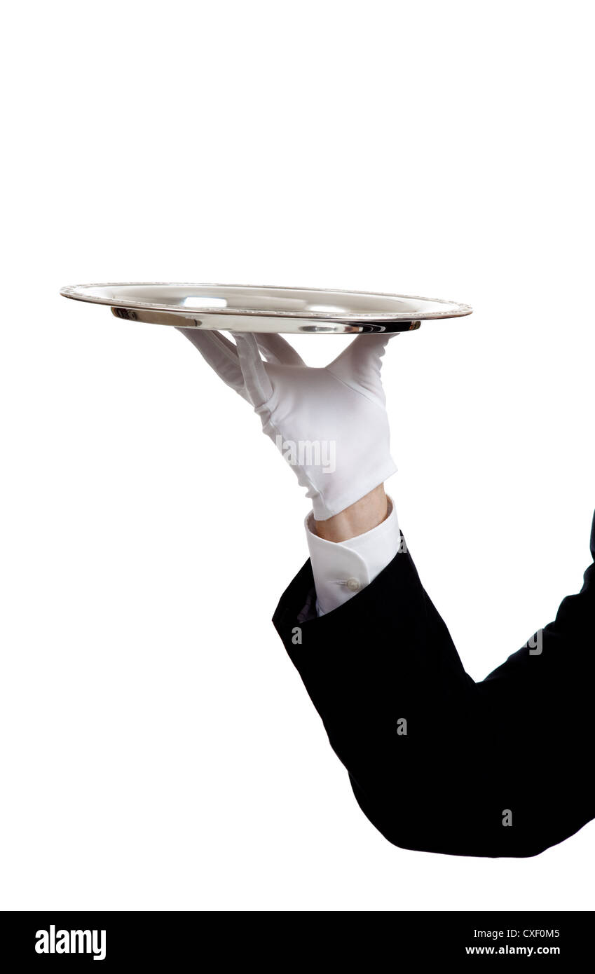 White gloved hand of a waiter holding a silver tray on a white background with copy space Stock Photo