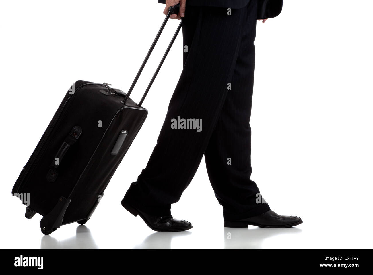 Business man rolling luggage on a white background Stock Photo Alamy