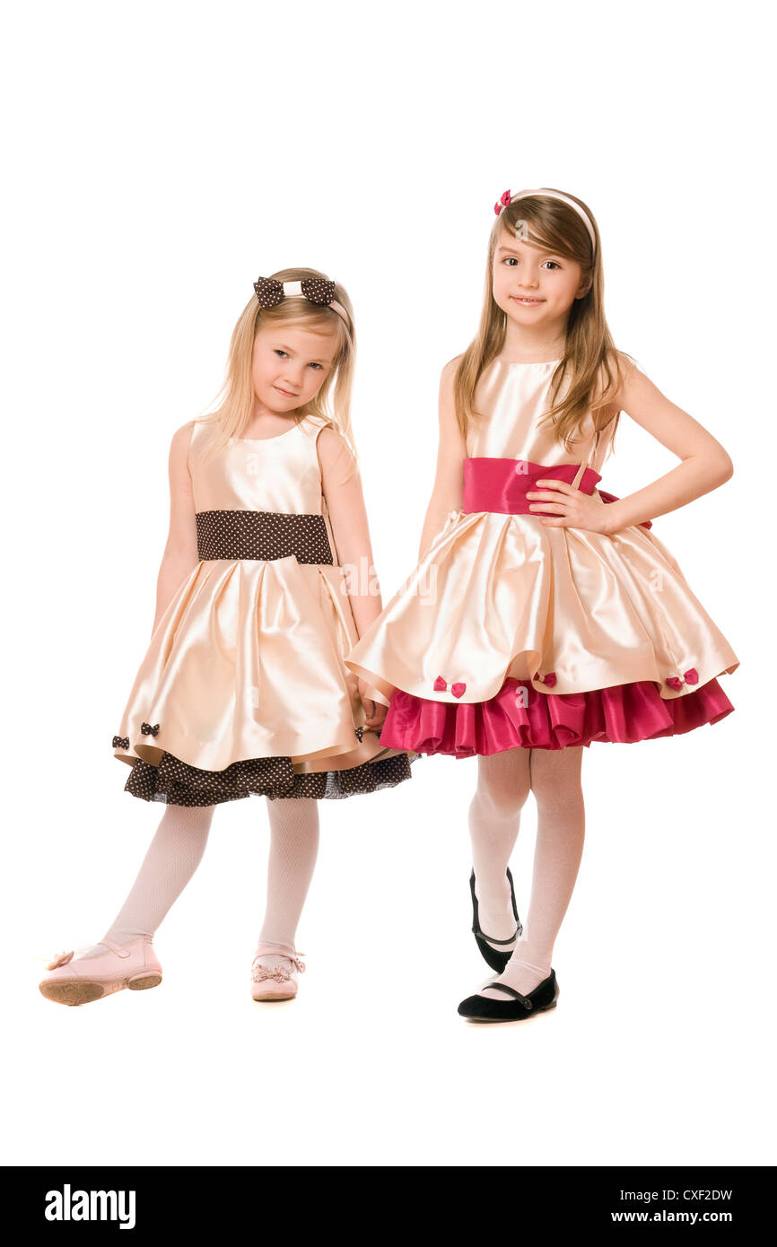 Two cute little girls in a dress Stock Photo - Alamy