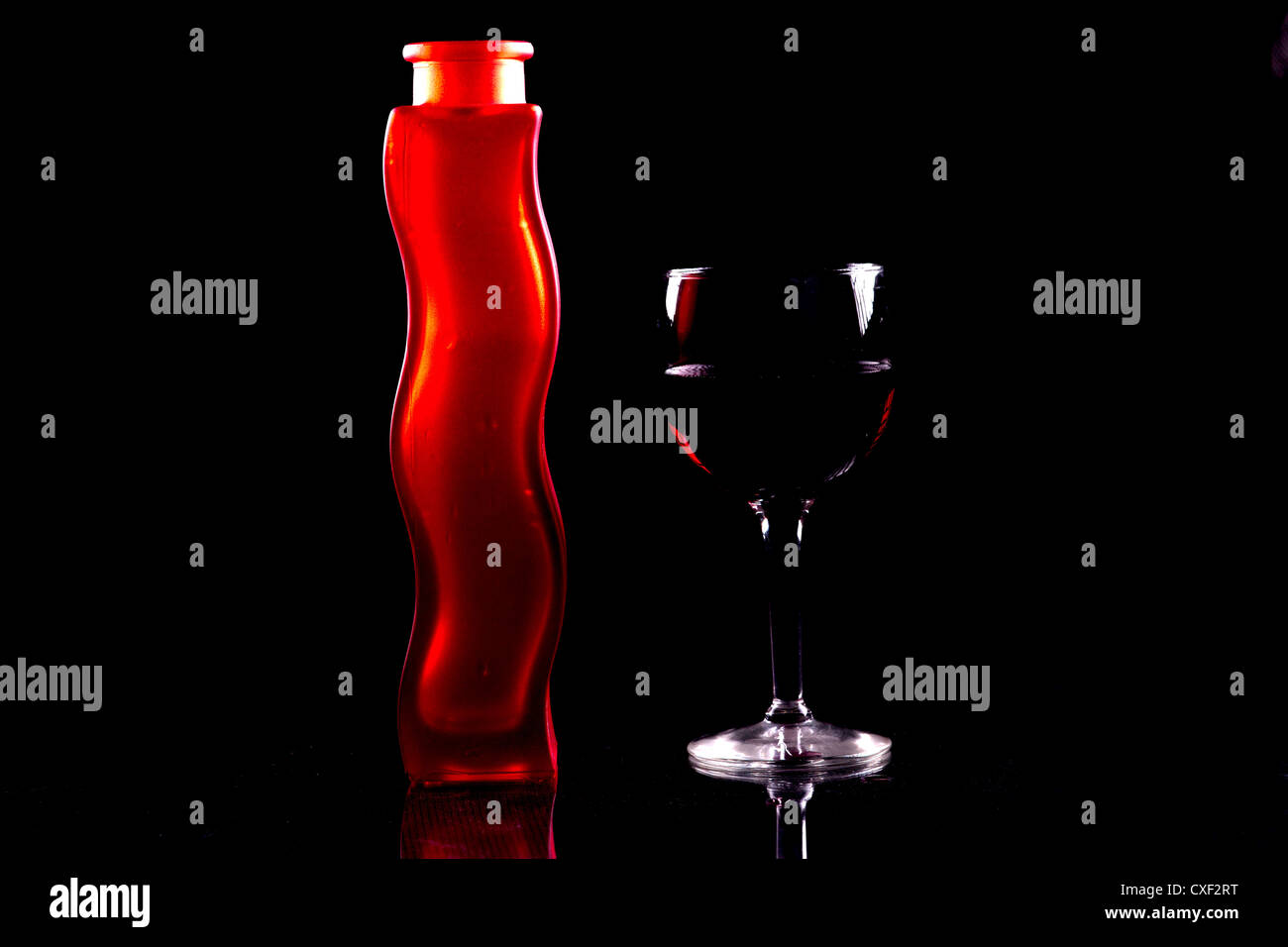 Red wine and red vase. Stock Photo