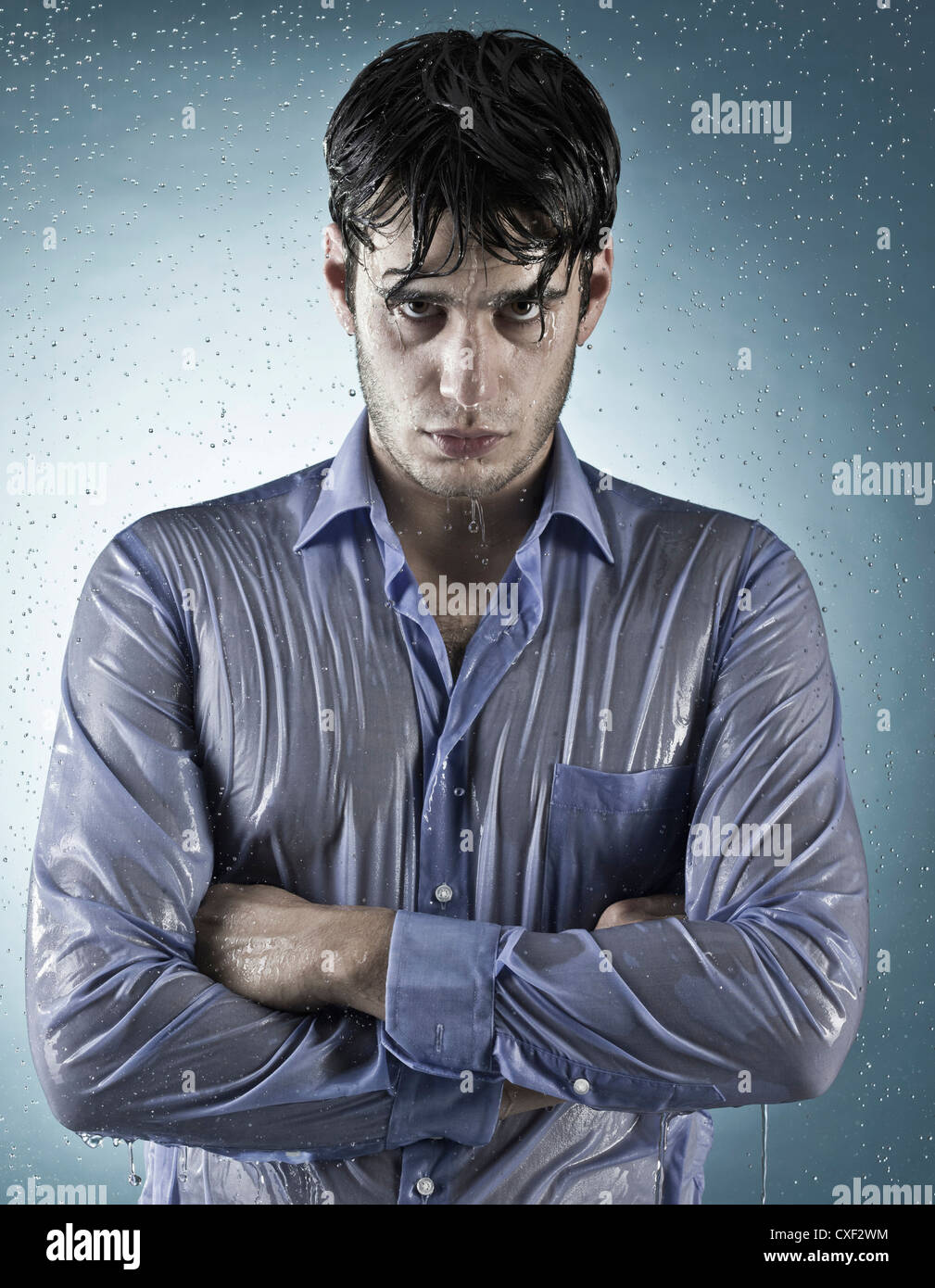 Caucasian man taking a shower in clothing Stock Photo