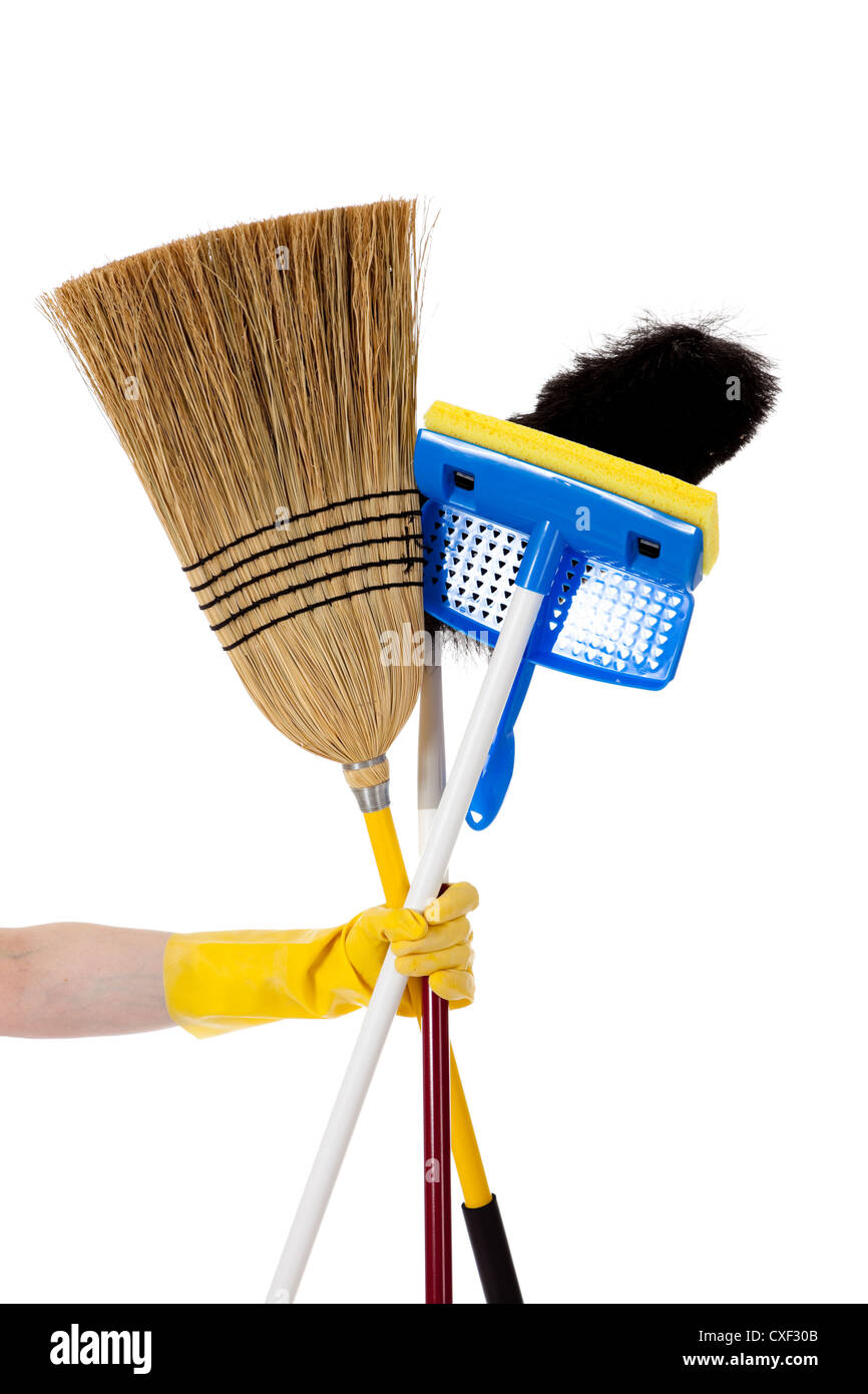 Rubber gloved hand holding a broom, mop and duster Stock Photo Alamy
