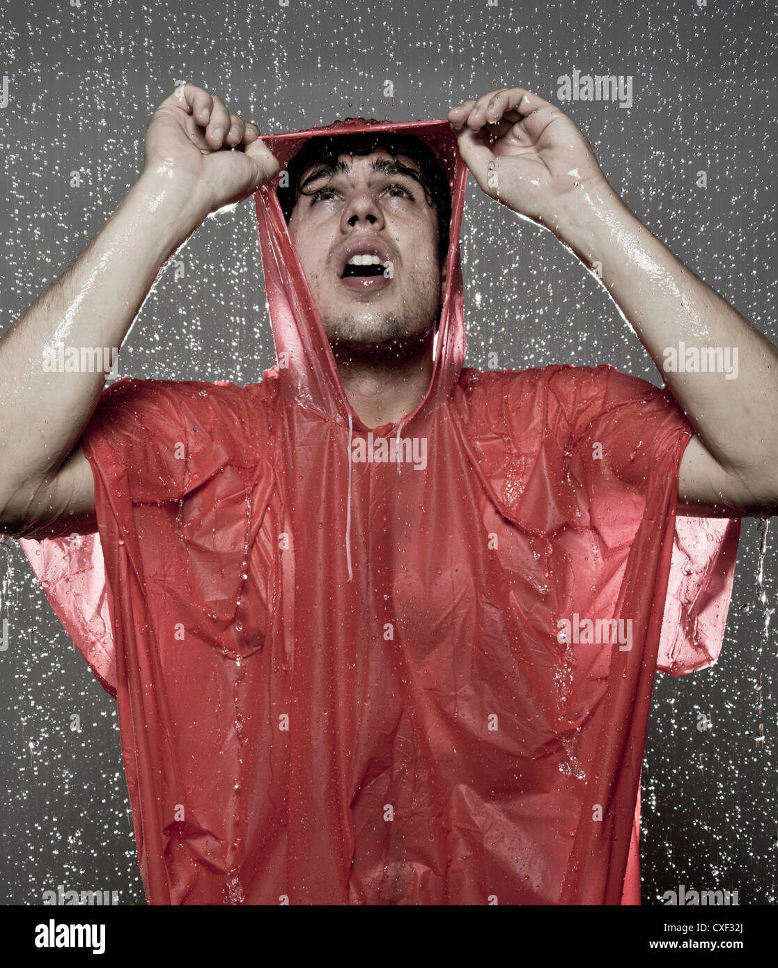 Caucasian man caught in the rain Stock Photo