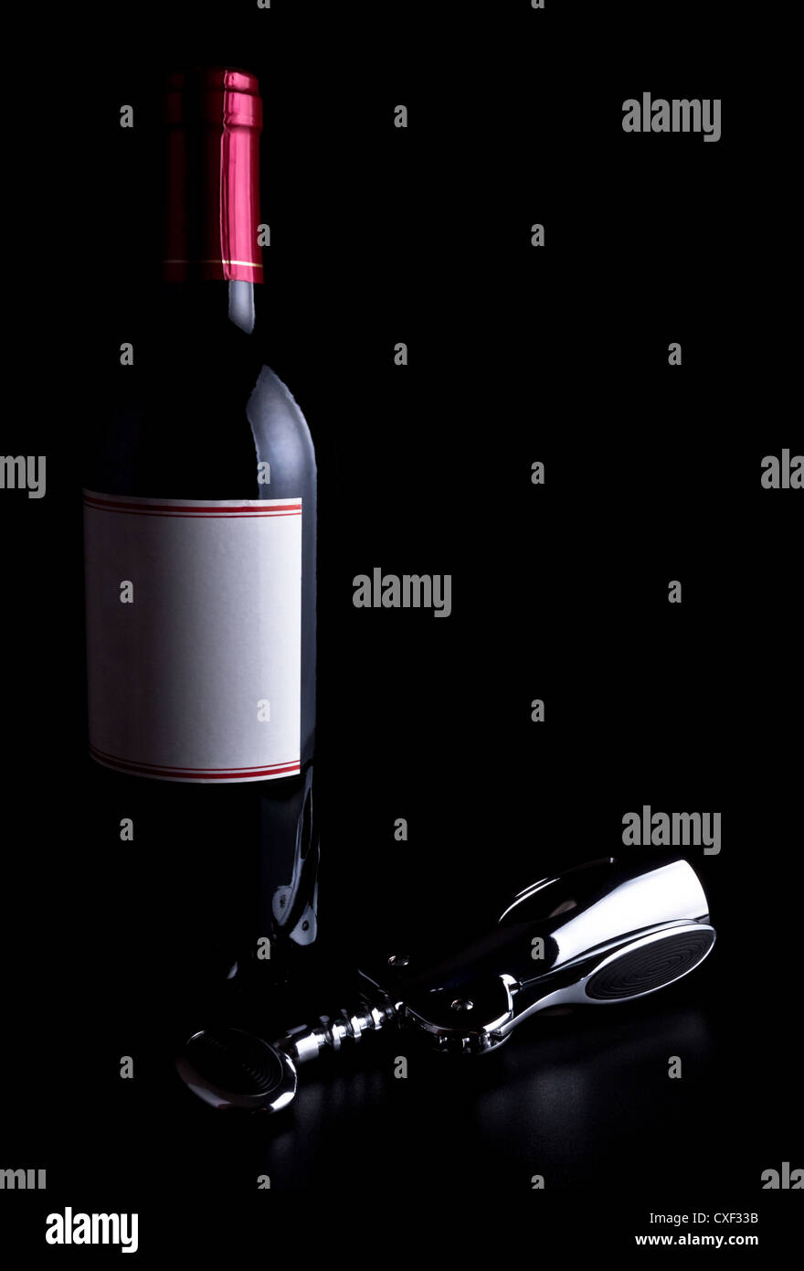 bottle of wine and corkscrew Stock Photo