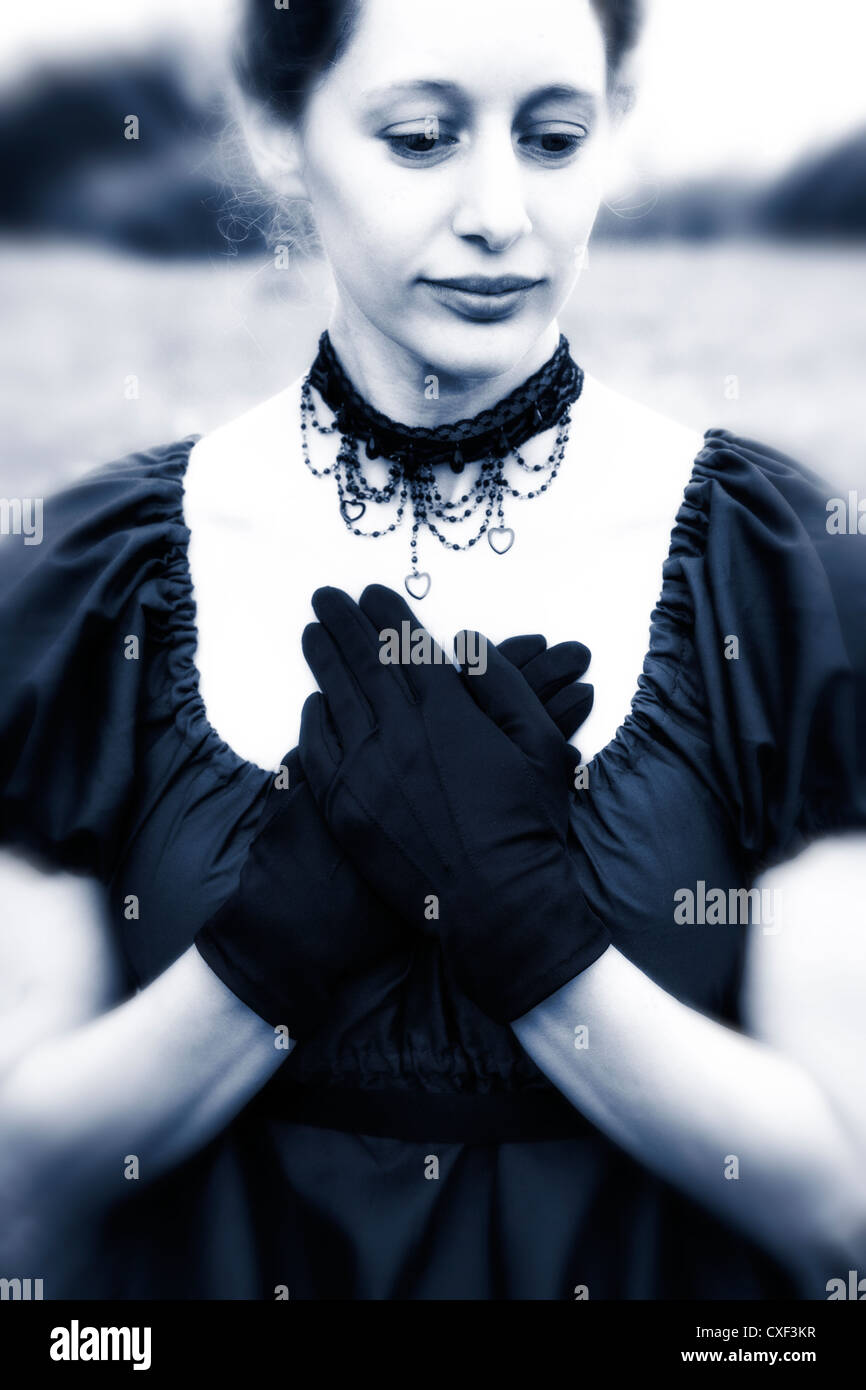 portrait of a beautiful young lady with gloves and necklace Stock Photo