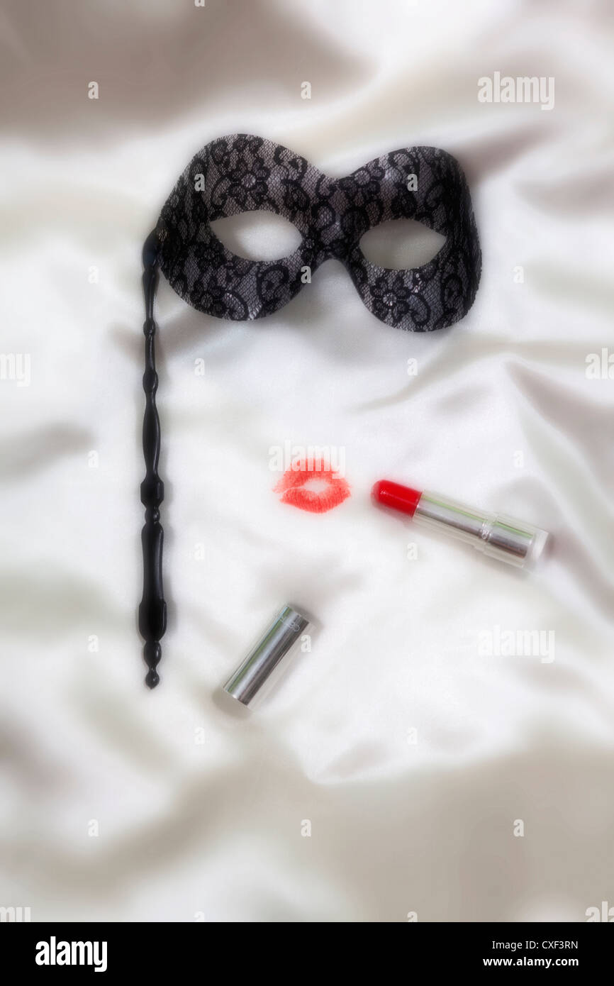 kissing lips with a venetian mask Stock Photo