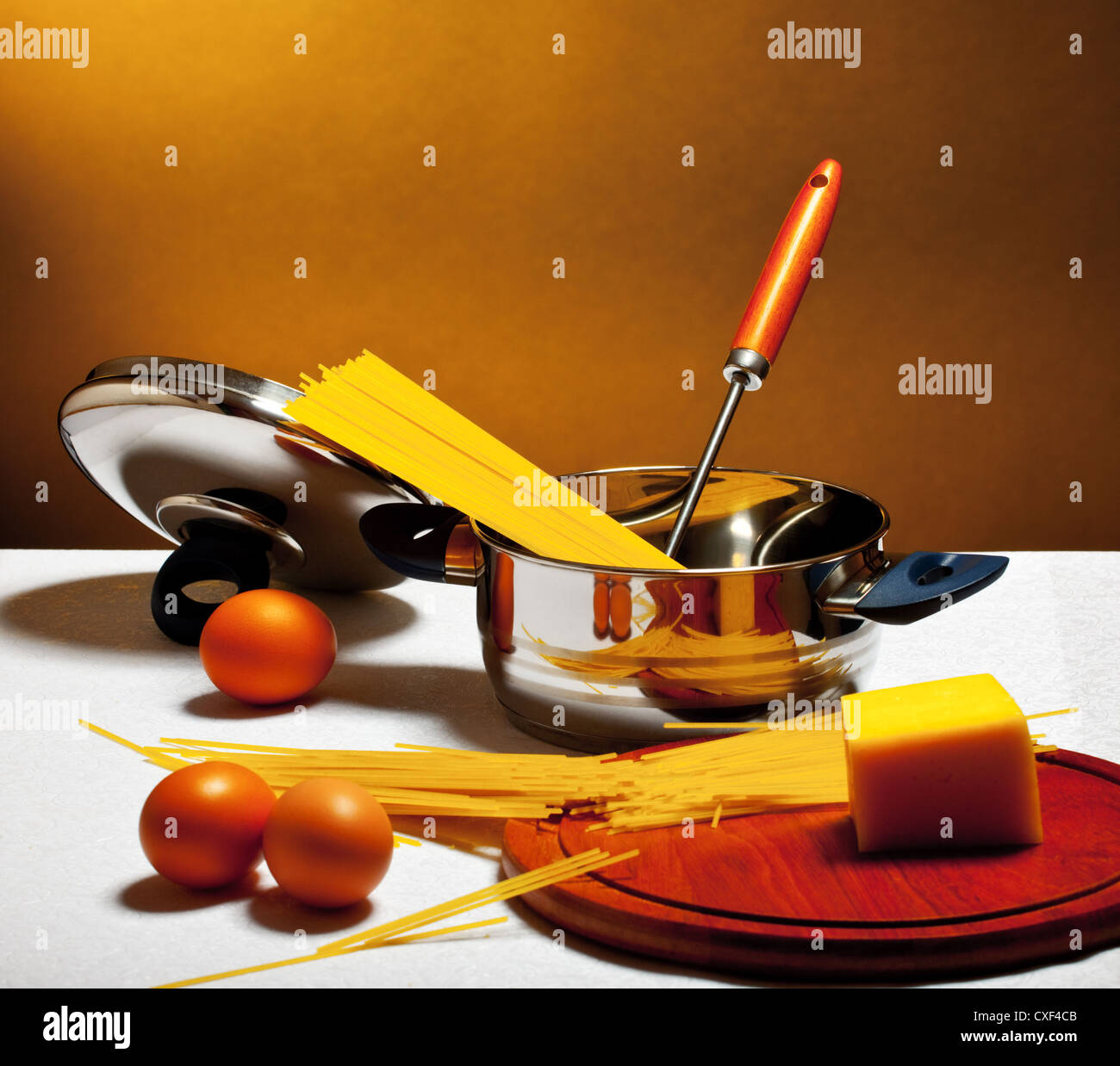 spaghetti, eggs and cheese on table Stock Photo Alamy