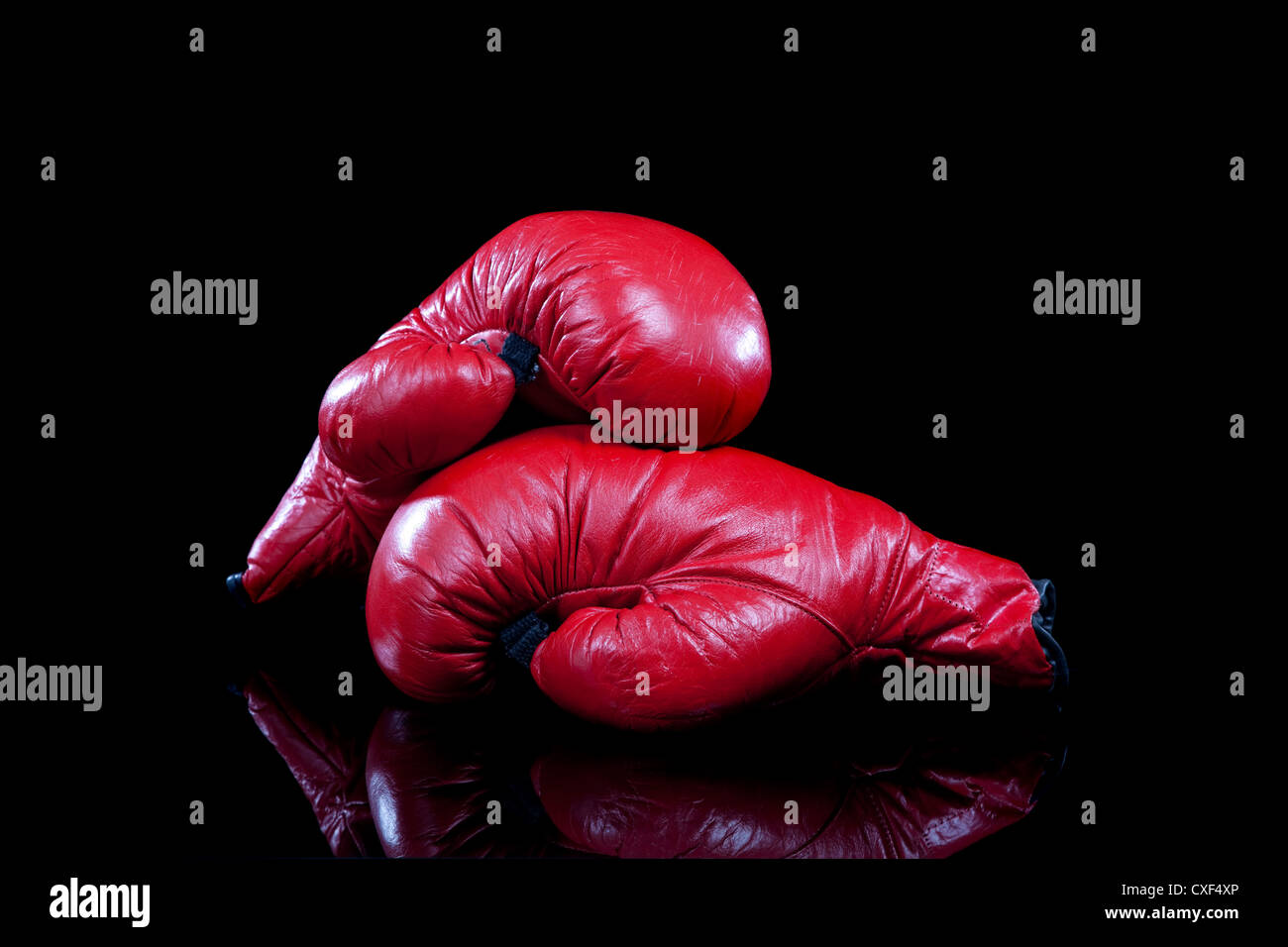 Red boxing gloves on a black background Stock Photo