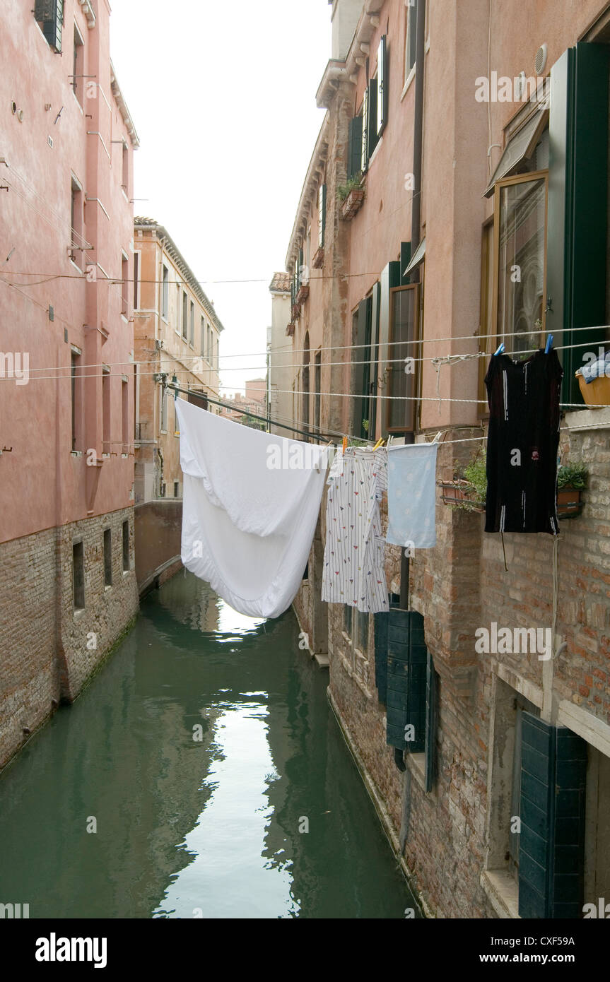 washing hanging out to dry over canal in venice back street alley alleys backalley backstreet Stock Photo