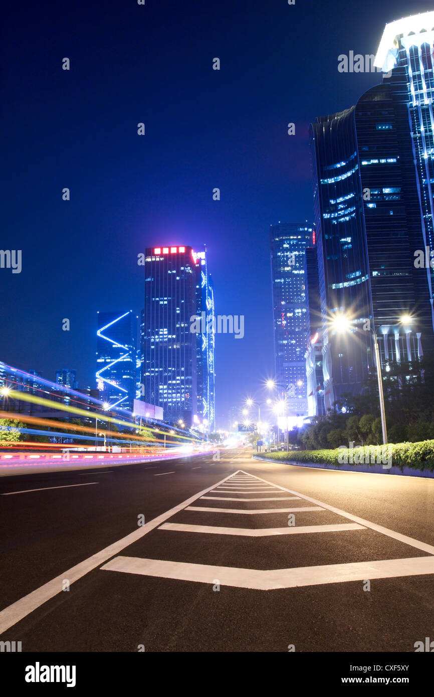 light trails on the ramp with building background Stock Photo - Alamy