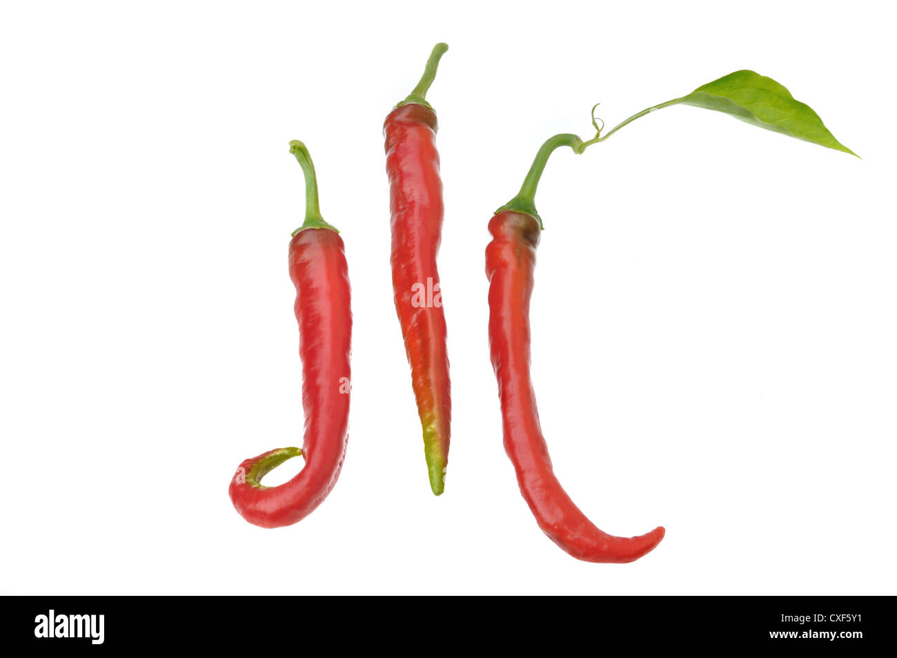 Triangle Form Pepper three red peppers with different shapes on white background Stock Photo ...