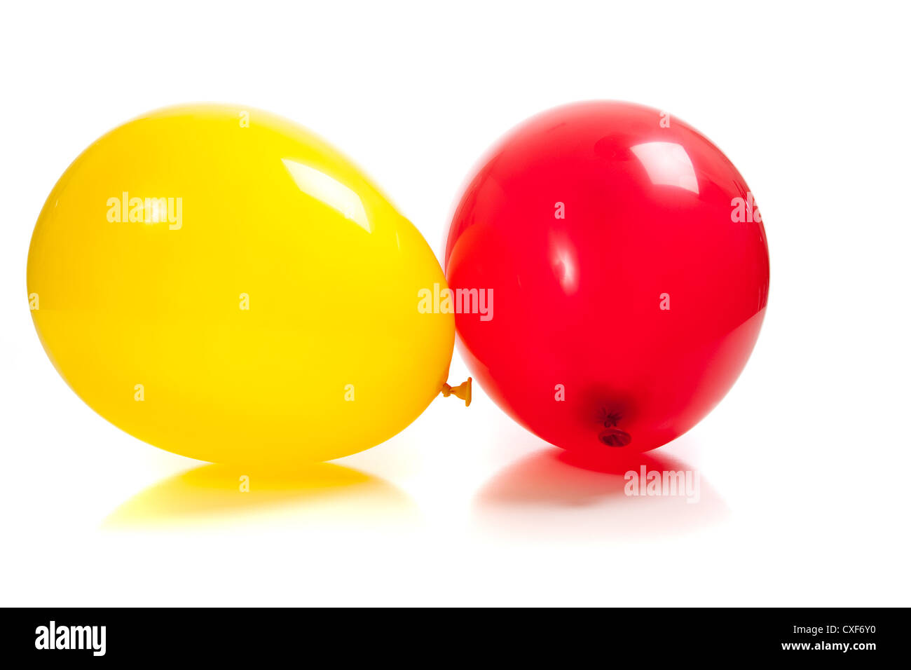 A red and yellow balloon on a white background Stock Photo - Alamy