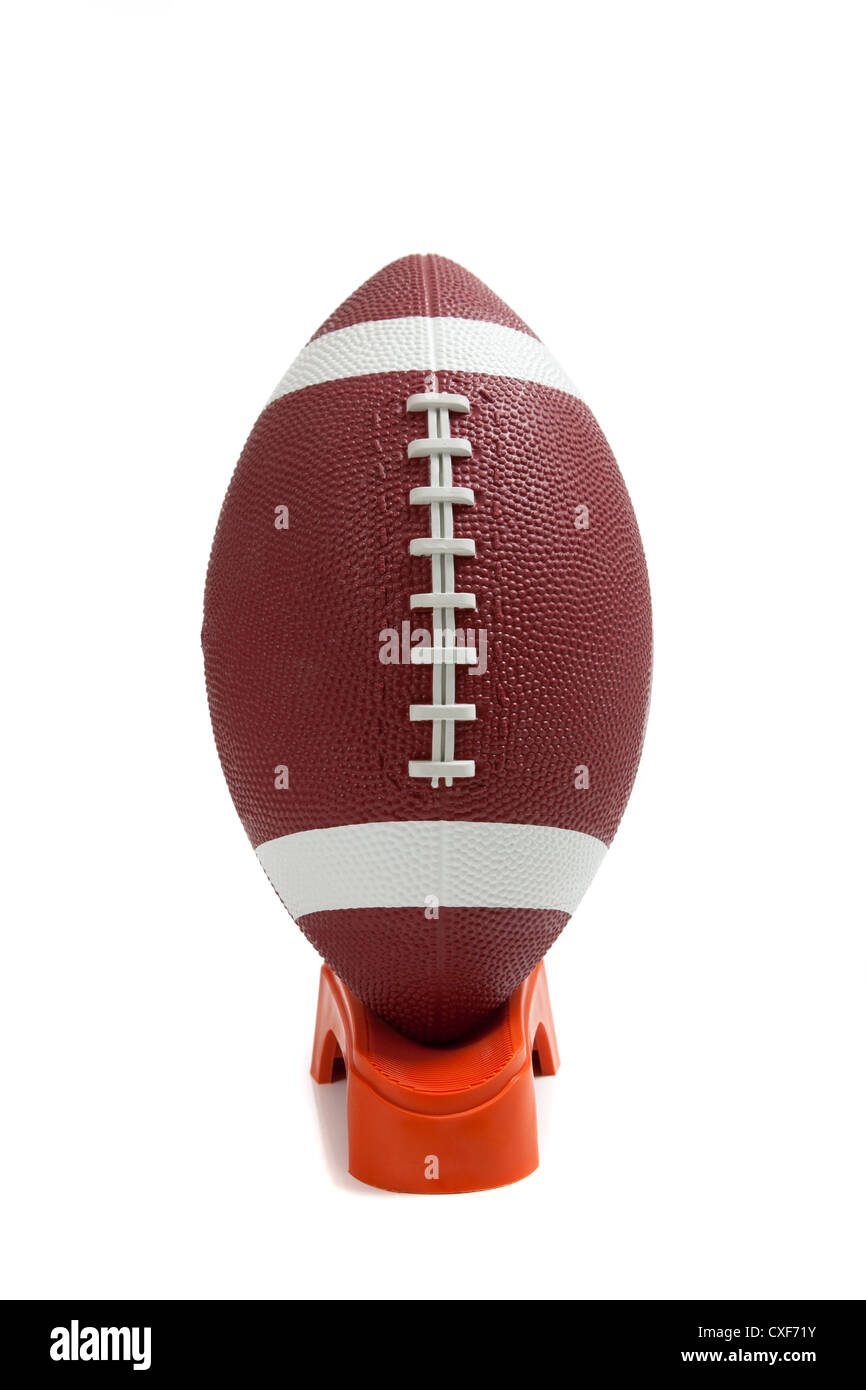 American football on a kicking tee Stock Photo