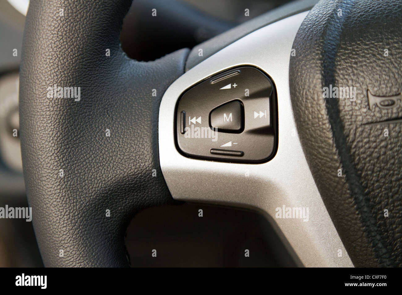 Audio control knob on a steering wheel Stock Photo Alamy
