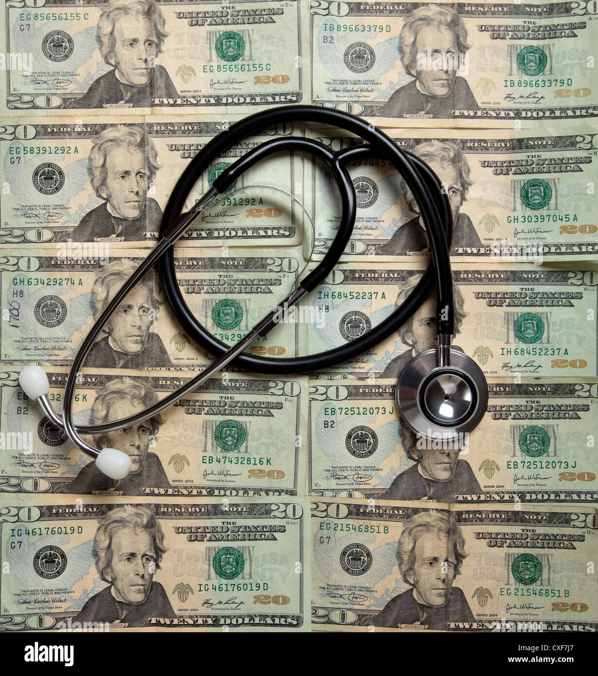 Stethoscope on a background of $20 bills Stock Photo