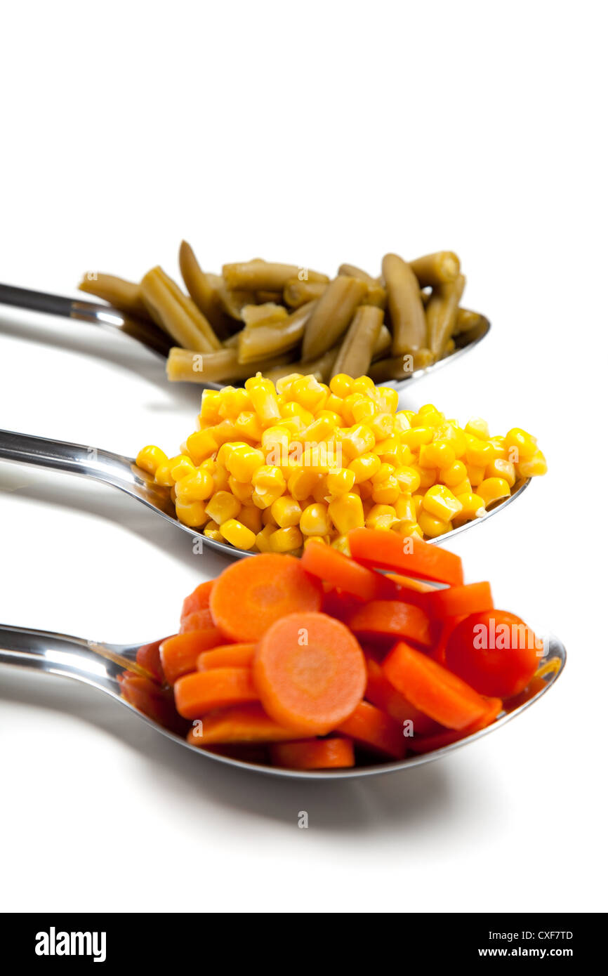 Serving spoons full of vegetables Stock Photo Alamy