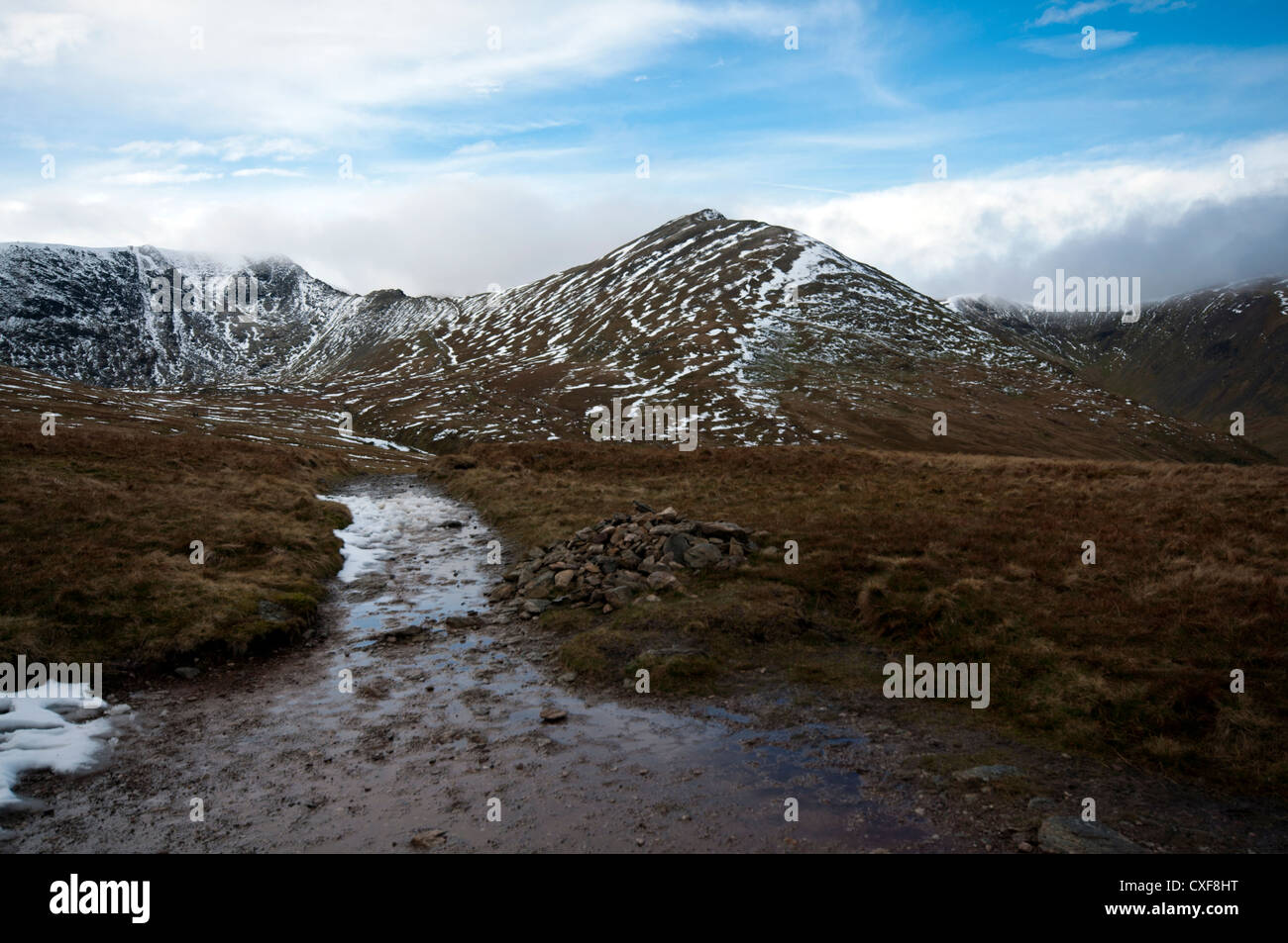 The summit of Catstye Cam with Swirral Edge seen to the left, connecting with Helvellyn in the Lake District National Park Stock Photo