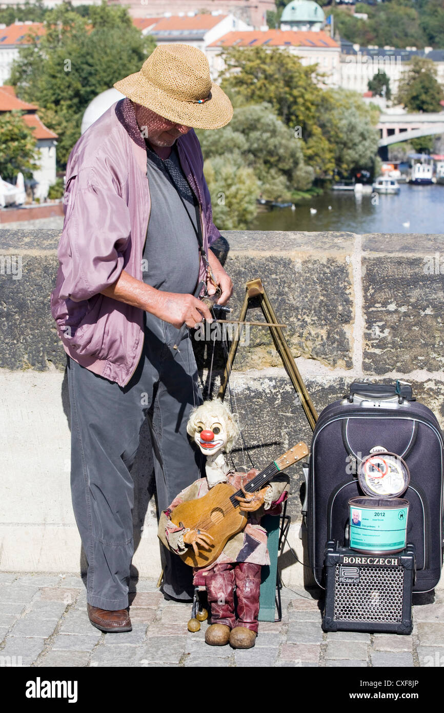 Puppeteer  on the streets of Prague with his clown puppet Stock Photo