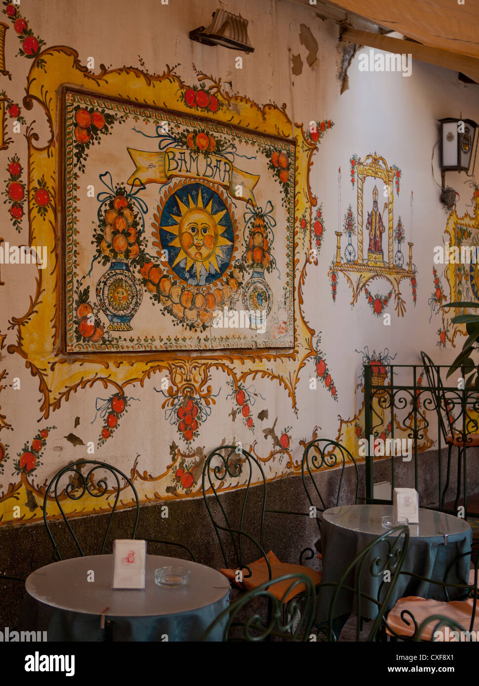 Restaurant tables with tile mural of sun hi-res stock photography and ...